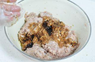 Steamed Pork Meatballs with Shiitake Mushrooms step 5: Season the mixture with light soy sauce and salt, stirring well to distribute th