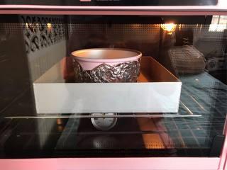 Japanese Yogurt Cheesecake step 12: Place the cake pan in a baking tray filled with about 1 cm of hot water. Bake at