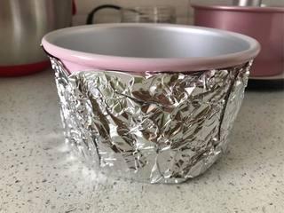 Japanese Yogurt Cheesecake step 2: Place the wrapped cake pan inside a larger baking pan and seal the bottom secure