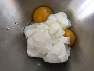Japanese Yogurt Cheesecake step 3: Separate the egg whites and yolks. Add the yogurt to the egg yolks.