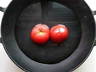 Egg and Tomato Stir-Fry step 2: Place the tomatoes in boiling water for a few minutes to loosen the skins.