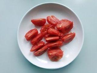 Egg and Tomato Stir-Fry step 3: Peel the tomatoes and cut them into bite-sized chunks.