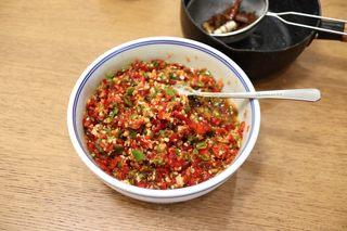 Sizzling Chili Garlic Sauce step 10: Strain the hot aromatic oil directly over the chili mixture and stir well to com
