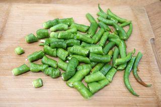 Sizzling Chili Garlic Sauce step 2: Cut the green chilies into small pieces.