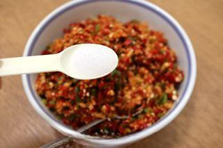 Sizzling Chili Garlic Sauce step 7: Transfer the chili mixture to a large bowl. Add salt and mix thoroughly to seaso