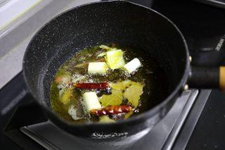 Sizzling Chili Garlic Sauce step 9: Heat the oil with all aromatics over low heat until fragrant and the scallion be
