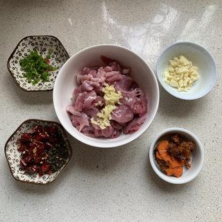 Spicy Pork Loin Hot Pot step 1: Slice the pork loin thinly against the grain.