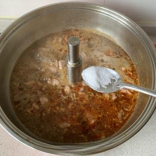 Spicy Pork Loin Hot Pot step 8: Slide the marinated pork slices into the simmering broth. Season with white pepp