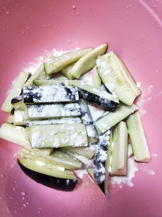 Braised Eggplant, Potato and Green Pepper step 5: Lightly coat the eggplant strips with flour.