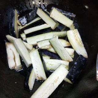 Braised Eggplant, Potato and Green Pepper step 6: Add the eggplant to the skillet and cook until lightly crisp.