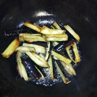 Braised Eggplant, Potato and Green Pepper step 7: Continue cooking until the eggplant becomes tender and develops a light golden-b