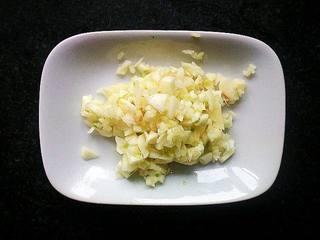 Garlic Stir-Fried Bok Choy step 2: Finely mince the garlic and divide it into two portions.