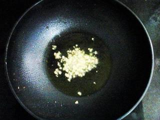 Garlic Stir-Fried Bok Choy step 3: Heat oil in a wok over medium heat. Add half of the minced garlic and stir-fry u