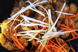 Sweet and Sour Pork step 11: Add the carrot, ginger, and scallion shreds. Stir-fry briefly and serve immediat