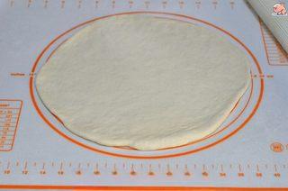 Homemade Shrimp and Chicken Pizza step 5: Roll the risen dough into a round slightly larger than a 9-inch pizza pan. Let i