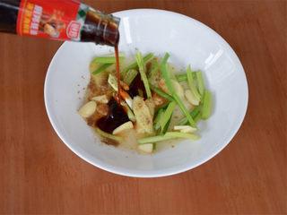 Chinese Steamed Sea Bass step 4: Add oyster sauce and steamed fish soy sauce to the dish.