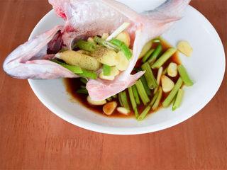 Chinese Steamed Sea Bass step 5: Place some of the seasonings inside the fish cavity to enhance flavor.