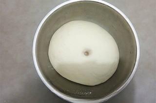 Steamed Red Bean Buns step 1: Combine the flour and yeast in a large bowl. Gradually add warm water and mix un