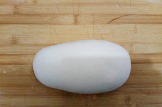 Steamed Red Bean Buns step 7: Divide the dough into equal portions and roll each piece into a round wrapper wi