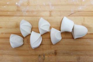 Steamed Red Bean Buns step 8: Place a portion of red bean filling in the center of each wrapper. Gather and pi