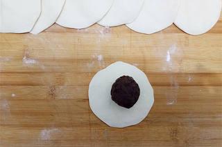 Steamed Red Bean Buns step 9: Arrange the buns in a steamer lined with parchment paper, leaving space between 
