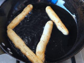 Cumin Fried Dough Sticks step 10: Fry until golden brown and crisp on all sides, then transfer to a wire rack or p