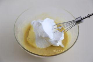 Osmanthus Chiffon Cake step 7: Fold one-third of the meringue into the yolk batter using gentle folding motions