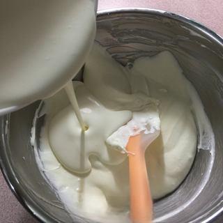 Classic Tiramisu Cake step 4: Fold the whipped cream into the mascarpone until fully combined.