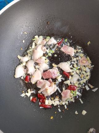 Stir-Fried Cabbage with Pork step 5: Add the pork slices and stir-fry until they begin to brown and release their fat