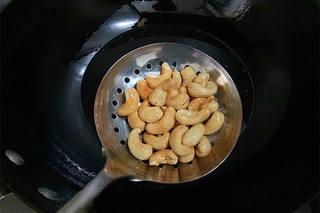 Sweet and Spicy Cashew Shrimp step 8: Heat oil in a wok and fry the shrimp until lightly crisp and cooked through. Rem