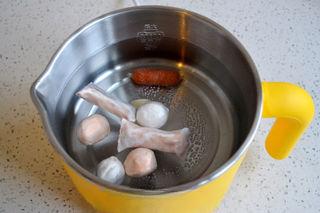 Cheesy Kimchi Ramen step 2: Bring a pot of water to a boil and add the fish balls. Cook until heated through