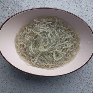Sichuan Hot and Sour Vermicelli step 4: Drain and rinse under cold water to stop the cooking process.