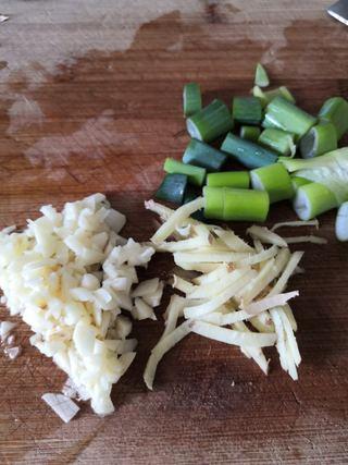 Braised Fish-Fragrant Eggplant step 2: Prepare the ginger, green onion, and garlic by finely chopping them.