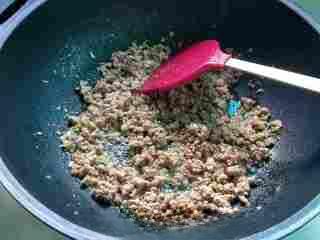 Stir-Fried Pickled Long Beans with Ground Pork step 8: Add the chopped pickled long beans, sliced chilies, and green onions.