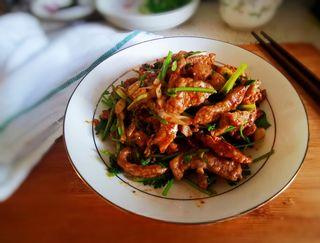 Cumin Lamb Stir-Fry with Cilantro step 14: Transfer to the prepared serving plate and serve immediately.