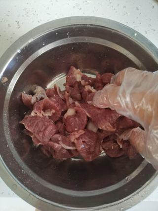 Cumin Lamb Stir-Fry with Cilantro step 4: Add the egg white and continue mixing until fully absorbed by the meat.