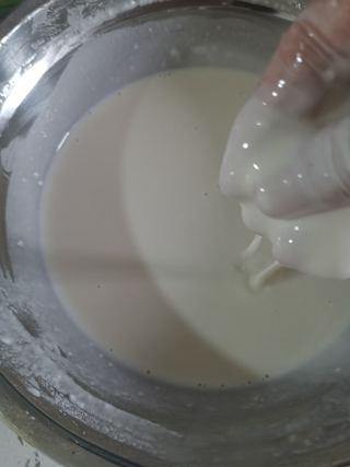 Easy Scallion Egg Pancakes step 2: Continue adding water little by little until the batter becomes smooth, lump-fre