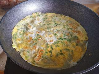 Easy Scallion Egg Pancakes step 6: Cook until the bottom is golden brown, then carefully flip the pancake.