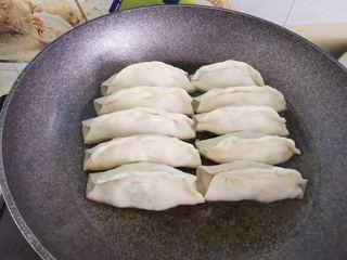 Beef Potstickers step 11: Heat a nonstick skillet with a small amount of oil and arrange the potstickers i