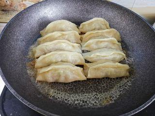 Beef Potstickers step 14: Remove the lid and continue cooking over low heat until the bottoms become golde