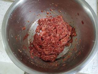 Beef Potstickers step 4: In a bowl, combine the ground beef, minced ginger, salt, soy sauce, and chicken