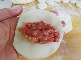 Beef Potstickers step 8: Roll each piece into a thin round wrapper.