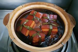 Red-Braised Pork Belly step 11: When the pork is fork-tender, remove the spice bag and aromatics.