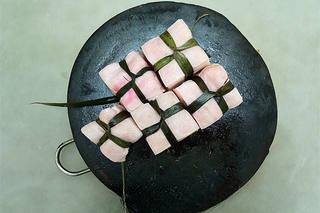 Red-Braised Pork Belly step 3: Place the pork belly in a pot of cold water. Bring to a boil and skim off any fo