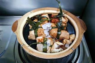 Red-Braised Pork Belly step 9: Bring to a boil over high heat, then reduce to very low heat. Cover and simmer g
