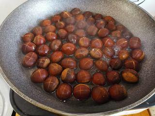 Candied Chestnuts step 5: Add hot water to about two-thirds of the pot, cover, and steam for 5 minutes.