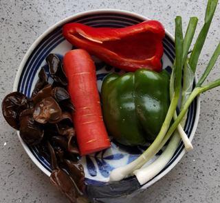 Fish-Fragrant Pork Strips step 2: Wash the carrot, bell peppers, scallion, garlic, and ginger. Soak the wood ear m