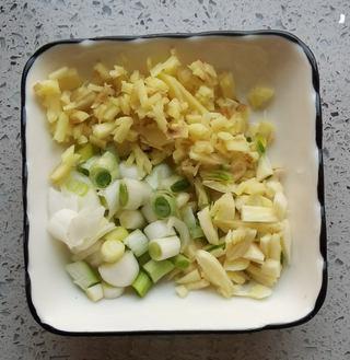 Fish-Fragrant Pork Strips step 4: Cut the pork into thin strips. Add the egg white, cornstarch, and cooking wine.