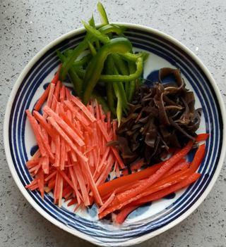Fish-Fragrant Pork Strips step 8: Add the marinated pork strips and stir-fry until they turn pale and are nearly c