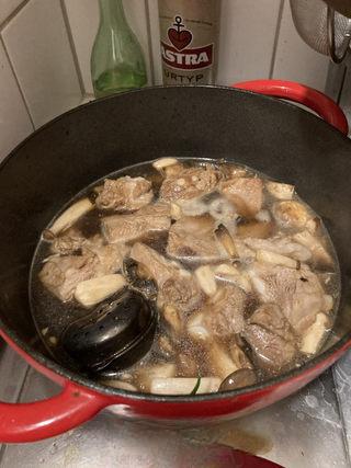 Braised Spare Ribs with Lotus Root and Mushrooms step 10: Cover and bring to a boil over high heat. Reduce to low heat and braise for abou
